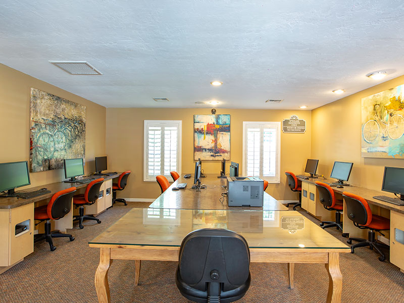 Wide view of computer lab with study area in the center